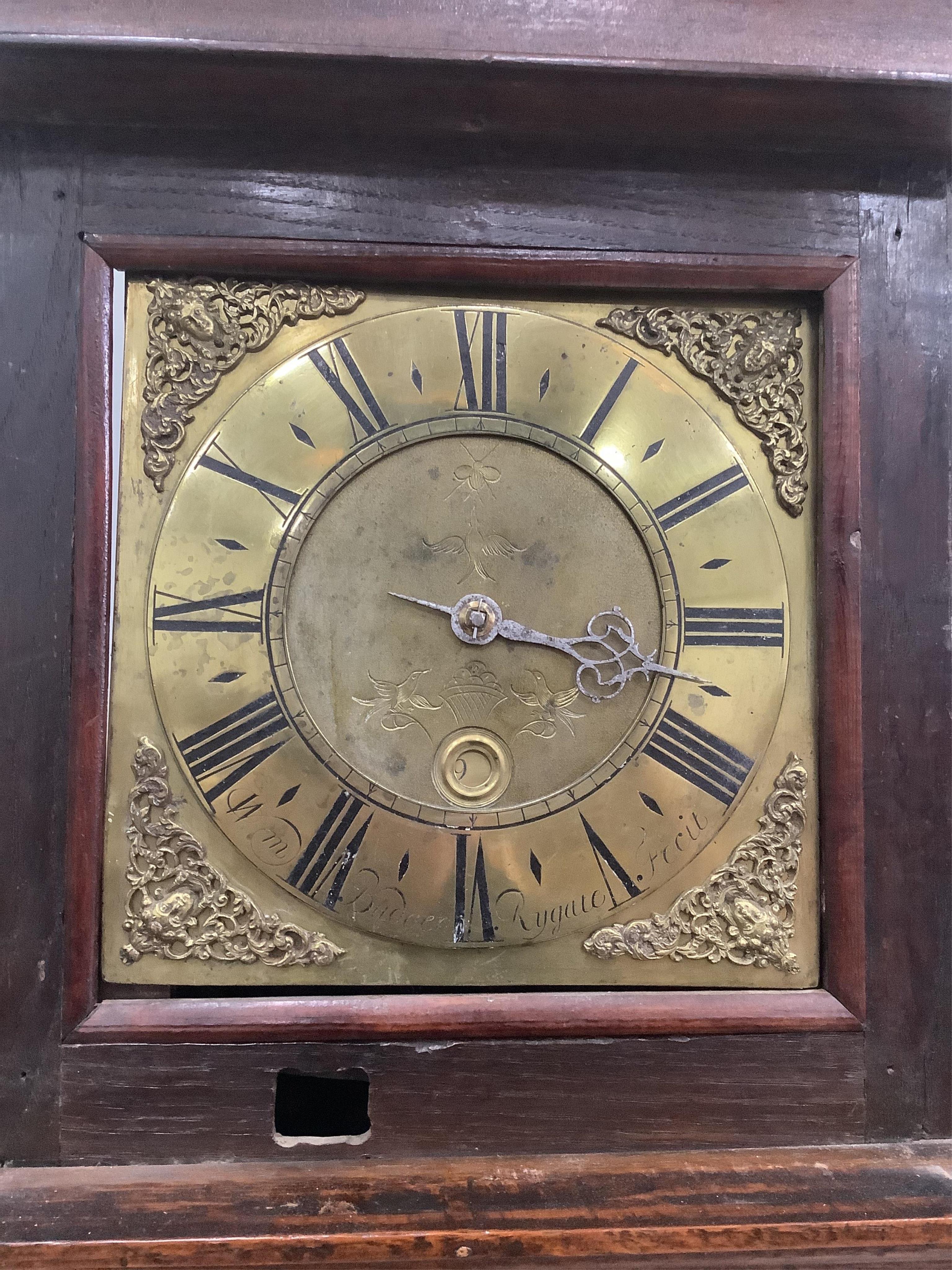 An early 18th century oak and mahogany thirty hour longcase clock, the square brass dial with a single hand, by William Budgen, Reigate, height 200cm. Condition - fair